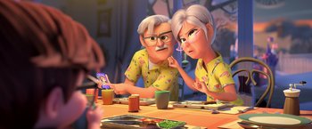 Movie still from “The Boss Baby 2: Family Business” (2021), directed by Tom McGrath – An older man and a younger woman sitting at a dinner table; Medium shot, Over the shoulder angle