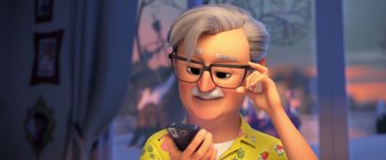 Movie still from “The Boss Baby 2: Family Business” (2021), directed by Tom McGrath – An old man with a mustache is looking at his cell phone; Close Up shot, Over the shoulder angle
