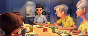 Movie still from “The Boss Baby 2: Family Business” (2021), directed by Tom McGrath – An animated woman sitting at a table with a man; Medium shot, Over the shoulder angle