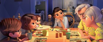 Movie still from “The Boss Baby 2: Family Business” (2021), directed by Tom McGrath – A group of people sitting at a table with plates of food in front of them; Wide shot, Over the shoulder angle