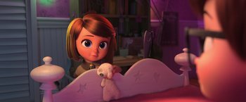 Movie still from “The Boss Baby 2: Family Business” (2021), directed by Tom McGrath – A little girl sitting in a bed with a stuffed animal; Medium shot, High angle