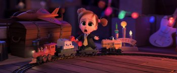 Movie still from “The Boss Baby 2: Family Business” (2021), directed by Tom McGrath – A little girl that is sitting on a toy train; Medium shot, High angle