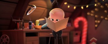 Movie still from “The Boss Baby 2: Family Business” (2021), directed by Tom McGrath – A small child is reading a book in a room; Medium shot, Over the shoulder angle