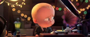 Movie still from “The Boss Baby 2: Family Business” (2021), directed by Tom McGrath – A cartoon of a little boy in a business suit; Medium shot, Over the shoulder angle