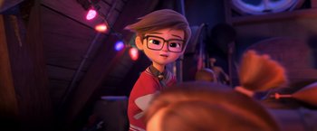 Movie still from “The Boss Baby 2: Family Business” (2021), directed by Tom McGrath – A boy with glasses is standing in front of some lights; Close Up shot, Over the shoulder angle