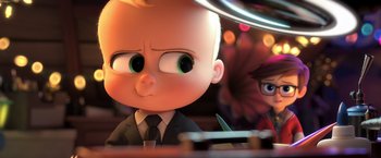 Movie still from “The Boss Baby 2: Family Business” (2021), directed by Tom McGrath – A baby boss from the movie the boss baby; Medium shot, Over the shoulder angle