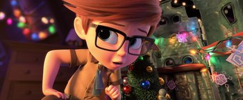 Movie still from “The Boss Baby 2: Family Business” (2021), directed by Tom McGrath – A cartoon boy with glasses is looking at a christmas tree; Close Up shot, Over the shoulder angle