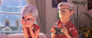 Movie still from “The Boss Baby 2: Family Business” (2021), directed by Tom McGrath – A couple of people that are looking at a camera; Medium shot, Over the shoulder angle