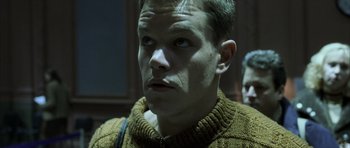 Movie still from “The Bourne Identity” (2002), directed by Doug Liman – A person wearing a sweater; Close Up shot, Low angle