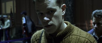 Movie still from “The Bourne Identity” (2002), directed by Doug Liman – A person wearing a sweater; Close Up shot, Low angle