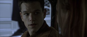 Movie still from “The Bourne Identity” (2002), directed by Doug Liman – A person wearing a sweater; Close Up shot, Over the shoulder angle