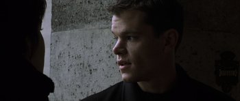 Movie still from “The Bourne Identity” (2002), directed by Doug Liman – A person looking to his left; Close Up shot, Low angle