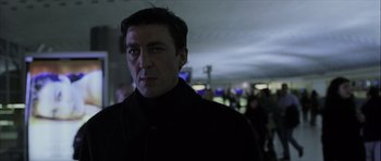 Movie still from “The Bourne Identity” (2002), directed by Doug Liman – A person wearing a black jacket; Close Up shot, Low angle