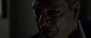 Movie still from “The Bourne Identity” (2002), directed by Doug Liman – A man's face in the dark; Extreme Close Up shot, Low angle