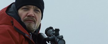 Movie still from “The Bourne Legacy” (2012), directed by Tony Gilroy – A person holding a camera; Close Up shot, Low angle