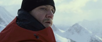 Movie still from “The Bourne Legacy” (2012), directed by Tony Gilroy – A person with a beard; Close Up shot, Low angle