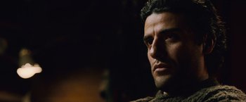 Movie still from “The Bourne Legacy” (2012), directed by Tony Gilroy – A man's face in a dark room; Close Up shot, Low angle