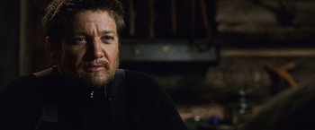 Movie still from “The Bourne Legacy” (2012), directed by Tony Gilroy – A person wearing a black shirt; Close Up shot, Over the shoulder angle