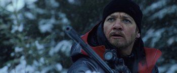 Movie still from “The Bourne Legacy” (2012), directed by Tony Gilroy – A person holding a rifle; Close Up shot, Low angle