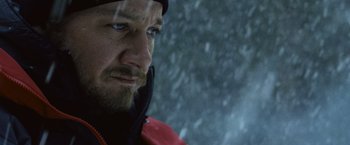 Movie still from “The Bourne Legacy” (2012), directed by Tony Gilroy – A person wearing a red jacket; Close Up shot, Over the shoulder angle