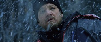 Movie still from “The Bourne Legacy” (2012), directed by Tony Gilroy – A person wearing a jacket and a hat; Close Up shot, Low angle