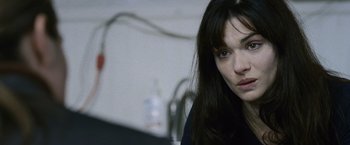 Movie still from “The Bourne Legacy” (2012), directed by Tony Gilroy – A woman sitting in front of a computer monitor; Close Up shot, Over the shoulder angle