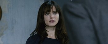 Movie still from “The Bourne Legacy” (2012), directed by Tony Gilroy – A person with long black hair; Close Up shot, Over the shoulder angle