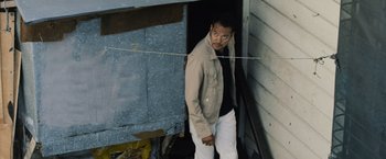 A man standing in front of a door way