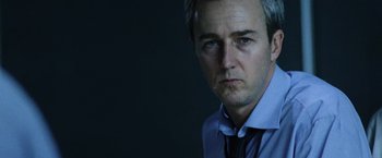 Movie still from “The Bourne Legacy” (2012), directed by Tony Gilroy – A person wearing a shirt and a tie; Close Up shot, Low angle