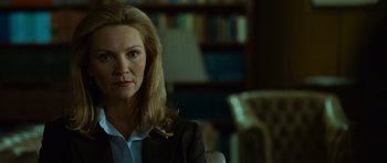 Movie still from “The Bourne Supremacy” (2004), directed by Paul Greengrass – A person sitting in a chair; Close Up shot, Over the shoulder angle