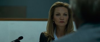 Movie still from “The Bourne Supremacy” (2004), directed by Paul Greengrass – A person wearing a suit and tie; Close Up shot, Over the shoulder angle