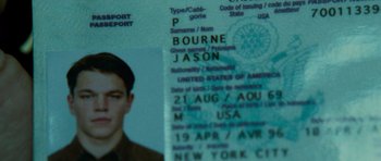 Movie still from “The Bourne Supremacy” (2004), directed by Paul Greengrass – A passport with a picture of a young man on it; Extreme Close Up shot, High angle