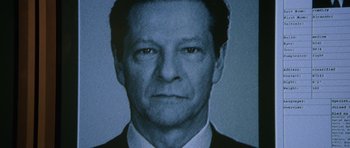 Movie still from “The Bourne Supremacy” (2004), directed by Paul Greengrass – A person wearing a suit and tie; Close Up shot, Low angle