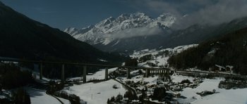 Movie still from “The Bourne Supremacy” (2004), directed by Paul Greengrass – A view of a bridge over a snow covered valley; Extreme Wide shot, High angle