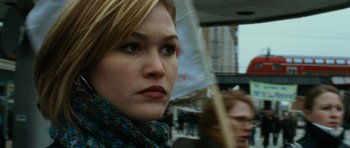 Movie still from “The Bourne Supremacy” (2004), directed by Paul Greengrass – A person holding an open umbrella; Close Up shot, Low angle