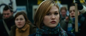 Movie still from “The Bourne Supremacy” (2004), directed by Paul Greengrass – A person wearing a scarf; Close Up shot, Over the shoulder angle