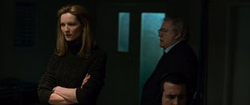 Movie still from “The Bourne Supremacy” (2004), directed by Paul Greengrass – A man and a woman standing next to each other in a room; Medium shot, Over the shoulder angle