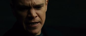 Movie still from “The Bourne Supremacy” (2004), directed by Paul Greengrass – A man's face in a dark room; Close Up shot, Low angle