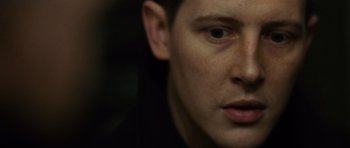 Movie still from “The Bourne Supremacy” (2004), directed by Paul Greengrass – A man's face in a dark room; Extreme Close Up shot, High angle
