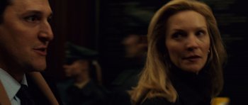 Movie still from “The Bourne Supremacy” (2004), directed by Paul Greengrass – A woman with long blonde hair is looking at the camera; Close Up shot, Over the shoulder angle