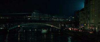 Movie still from “The Bourne Supremacy” (2004), directed by Paul Greengrass – A bridge over a body of water at night time; Extreme Wide shot, High angle