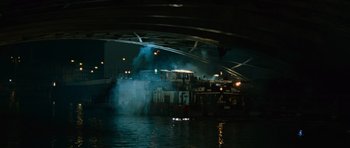 Movie still from “The Bourne Supremacy” (2004), directed by Paul Greengrass – A boat is in a body of water at night; Extreme Wide shot, High angle