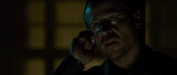 Movie still from “The Bourne Supremacy” (2004), directed by Paul Greengrass – A person wearing glasses; Close Up shot, Low angle