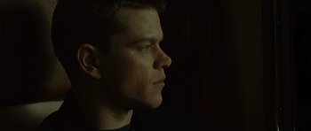 Movie still from “The Bourne Supremacy” (2004), directed by Paul Greengrass – A person looking to the side; Close Up shot, Low angle