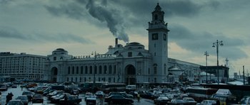 Movie still from “The Bourne Supremacy” (2004), directed by Paul Greengrass – A large building with a clock tower in the middle of it; Extreme Wide shot, Low angle