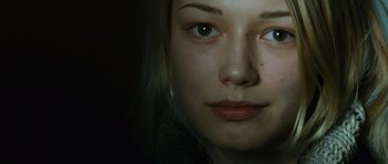 Movie still from “The Bourne Supremacy” (2004), directed by Paul Greengrass – A young woman's face in the dark; Close Up shot, High angle