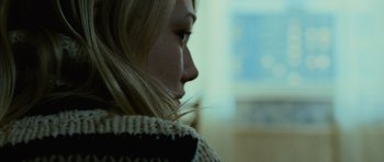 Movie still from “The Bourne Supremacy” (2004), directed by Paul Greengrass – A woman's face in a sweater; Close Up shot, Over the shoulder angle