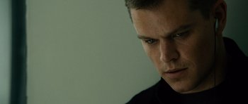 Movie still from “The Bourne Supremacy” (2004), directed by Paul Greengrass – A man's face in a black shirt; Close Up shot, Low angle