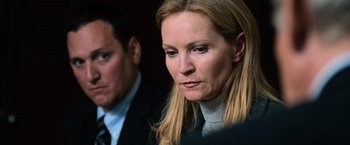 Movie still from “The Bourne Ultimatum” (2007), directed by Paul Greengrass – A woman and a man are looking at the camera; Close Up shot, Over the shoulder angle