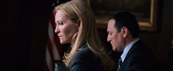 Movie still from “The Bourne Ultimatum” (2007), directed by Paul Greengrass – A woman and a man in a suit and tie; Close Up shot, Low angle